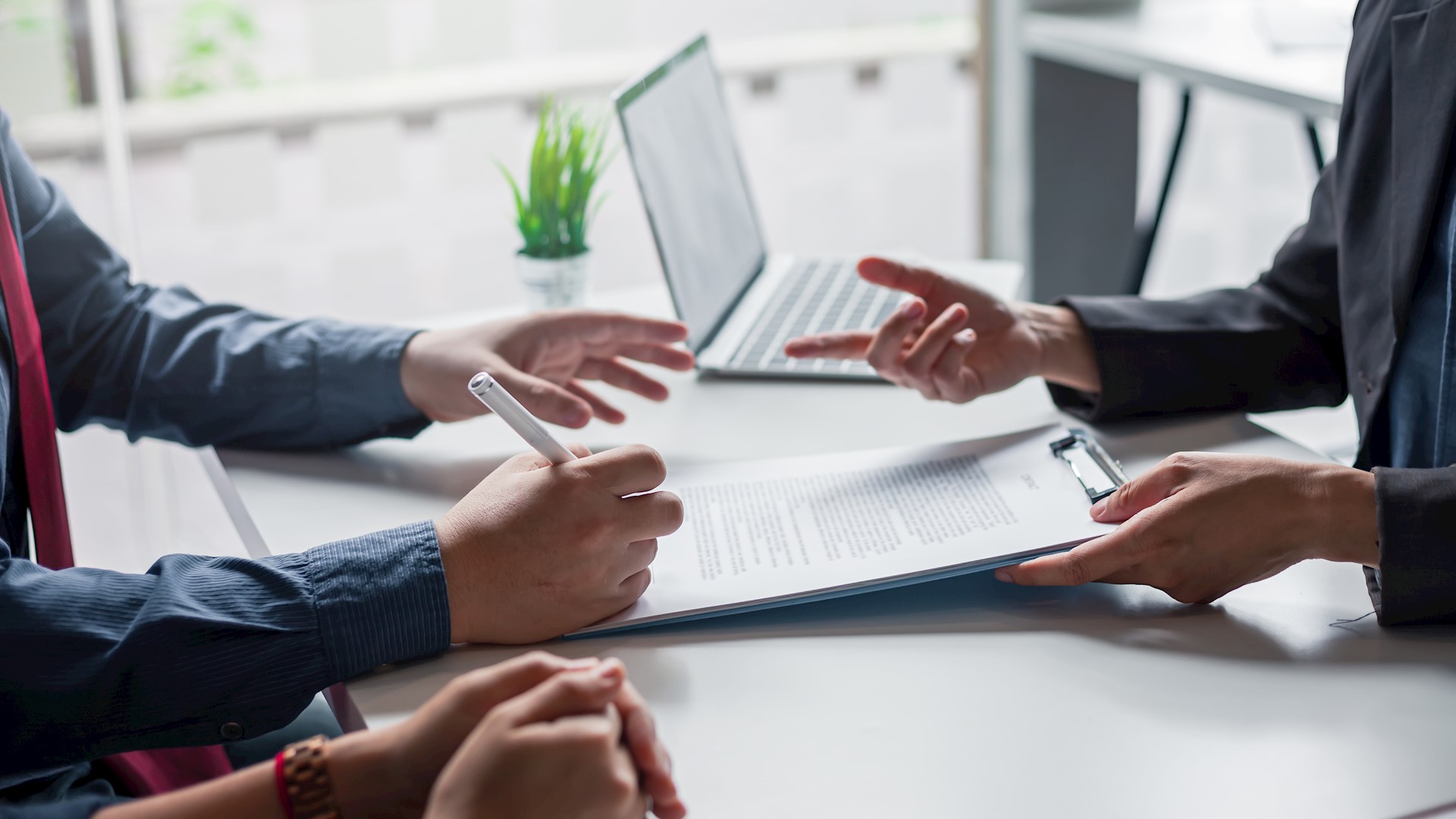 Signing a business contract. A group of business people at the meeting and sign a together business investment agreement.